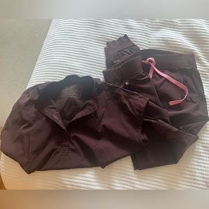 Brown figs scrubs with pink tie